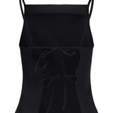 Sort crop top med tynde stropper og to bindebånd foran, placeret mod en hvid baggrund.
