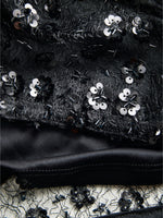 Detaljebillede af sort DREAM top med pailetter. Fra BySofieSønderby