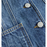 Detaljebillede af blå denim FAIZA vest. BySofieSønderby.