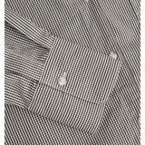 Detaljefoto af et ærme på en Jamie skjorte i brun hvide tern, hvide knapper. Fra By Sofie Sønderby