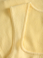 Detaljebillede af gul POSIE top. Fra BySofieSønderby