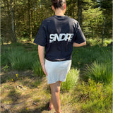 Modelfoto af pige, som bærer SNDRB t-shirt, sort og hvid nederdel - alt fra BySofieSønderby